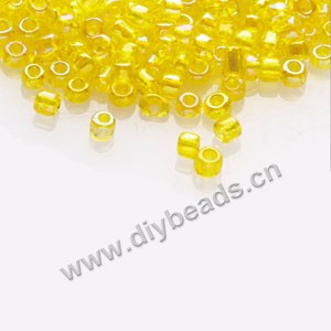 #11 seed beads,glass,yellow,rainbow,irregular round.sold per pkg of 1/2 kilo.
