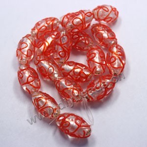Bead, lampworked glass, clear /red with silver-colored foil, 24x14mm oval with loop line design. Sold per pkg of 300.