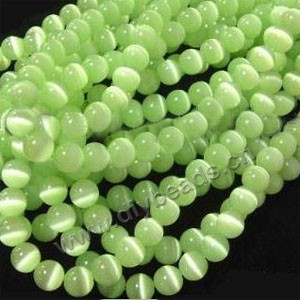 Bead, cat's eye glass,peridot, 10mm round, quality grade. Sold per (2)14.5-inch strands.