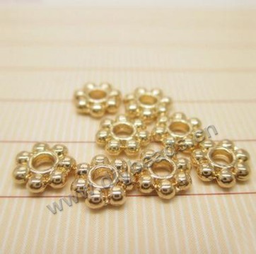 Bead,24k gold filled metal,7mm,round with flower, Sold per pkg of 100 pieces.