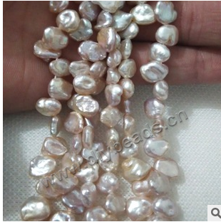 Pearl,cultured freshwater,white,9-10mm rice,half hole, AAgrade. Sold per pkg of 1 strand