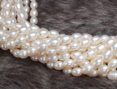 Pearl, cultured freshwater,white,5-6mm rice, AA grade. Sold per bag of one strand