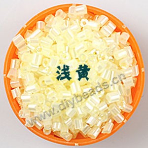 Bugle bead, glass,silky luster,light yellow ,#1 (3x2mm)beads. Sold per pkg of 80 grams,approximately 4,500ps.