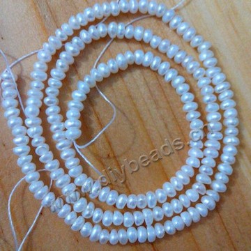 Pearl, cultured freshwater,white,2-3mm button round, AAA grade. Sold per pkg of one strand