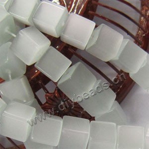 Bead, cat's eye glass, light green,8x8mm cube. Sold per 15-inch strand.