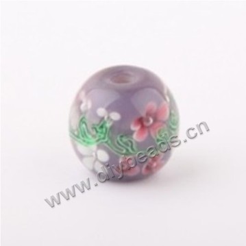 Bead, lampworked glass ,purple with flower, 14x14mm round.mini order 50pc 