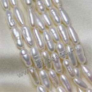 Pearl, cultured freshwater (bleached), white, 10-15mm oval, B grade, Mohs hardness 2-1/2 to 4. Sold per pkg of (10) 16-inch strands.