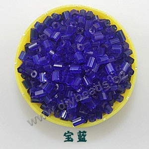 Bugle bead, glass,transparent crystal,cobalt blue ,#1(2x2mm) beads. Sold per pkg of 80 grams,approximately 4,500ps.
