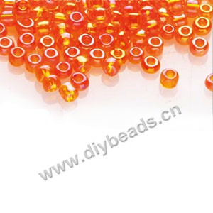 #11 seed beads,glass,orange-red,rainbow,irregular round.sold per pkg of 1/2 kilo.