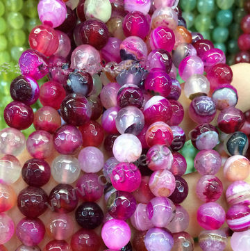 Bead, agate, 4mm faceted round, red with colorful stripe, football shape. Sold per 15-inch strand.