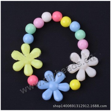 Children's bracelet,colorful acrylic  flower and star bracelet for wholesale. Sold per pkg of 1 pc.