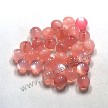 Bead, acrylic, cat's eye pink, 10mm round. Sold per pkg of 100ps