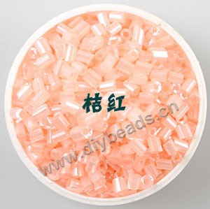 Bugle bead, glass,silky luster,light orange,#1 (3x2mm)beads. Sold per pkg of 80 grams,approximately 4,500ps.
