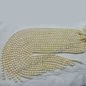 Pearl, cultured freshwater pearl (bleached), white , 5-6mm rice,B+ grade. Sold per pkg of (10) 15-inch strands.