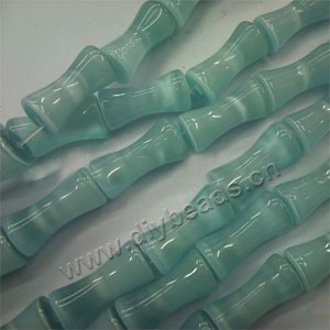 Bead, cat's eye glass, light green,20x10mm bamboo. Sold per 15-inch strand.