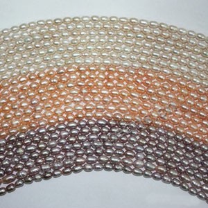 Pearl,cultured freshwater (natural), white/peach/mauve, 5-6mm rice, C grade. Sold per pkg of (25)16-inch strands.
