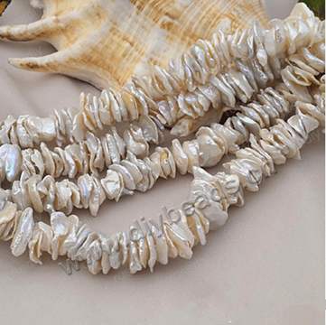 Pearl,cultured freshwater,white,10-13mm Baroque, AAA grade. Sold per pkg of one strand