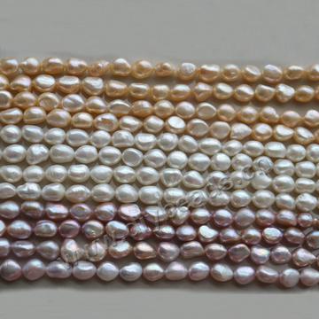 Pearl, natural baroque Pearls, white color, 10-11mm. Sold per pkg of 10 strands
