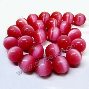 Bead, cat's eye glass,pink, 16mm round, quality grade. Sold per 14.5-inch strand,approximately 25 beads 