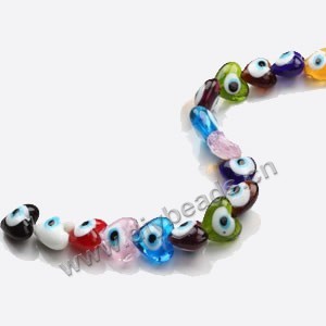 Bead mix, lampworked glass, multicolored, 20x20x12mm double-sided heart with wards off the evil eye design. Sold per pkg of 60.