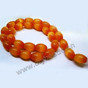 Bead, cat's eye glass, orange, 14x10mm  oval. Sold per 16-inch strand,approximately 28 beads .