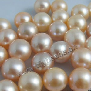 Pearl, cultured freshwater , peach, 10-11mm half-drilled round, AAA grade. Sold per pkg of 1pairs