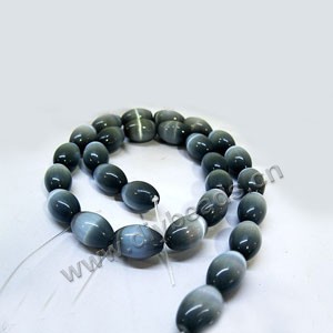 Bead, cat's eye glass, light blue, 14x10mm  oval. Sold per 16-inch strand,approximately 28 beads .