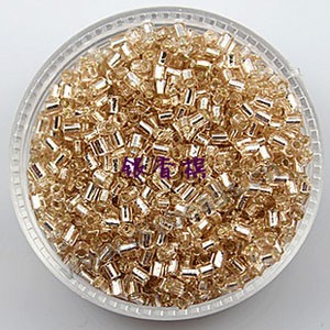 Bugle bead, glass,silver-lined,light brown ,#1(2x2mm) beads. Sold per pkg of 80 grams,approximately 4,500ps.