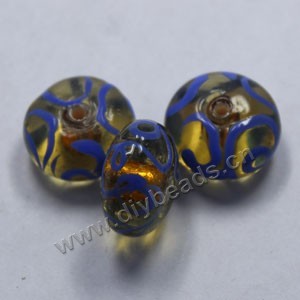 Bead,lampworked glass, clear and blue with gold-colored foil painted swirls, 16x10mm rondelle. Sold per pkg of 500.