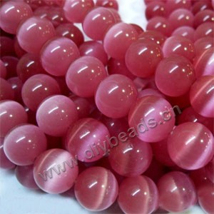 Bead, cat's eye glass,pink, 14mm round, quality grade. Sold per 14.5-inch strand,approximately 28 beads 