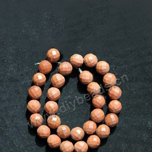 Bead, brown goldstone (manmade), 6mm 64-faceted round. Sold per 14.5-inch strand