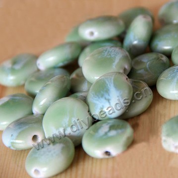 Bead , fancy glaze porcelain,green, 18mm*19mm*8mm button. Sold per pkg of 50 beads. 