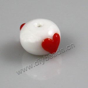 Bead, lampworked glass, opaque white and red, 8x10mm round with "heart"design. Sold per pkg of 6.
