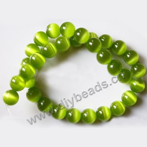 Bead, cat's eye glass,grass green, 12mm round, quality grade. Sold per (5) 14.5-inch strands.
