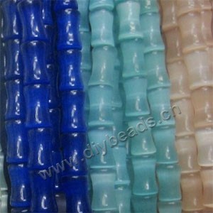 Bead mix, cat's eye glass, multicolored, 17x14mm bamboo. Sold per pkg of (2) 15-inch strands
