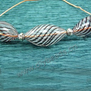 Bead, hand-blown glass, clear/white/brown, 23x11mm hollow oval. Sold per pkg of 10