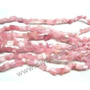 Bead, cat's eye glass, pink, chip. Sold per 32-inch strand.