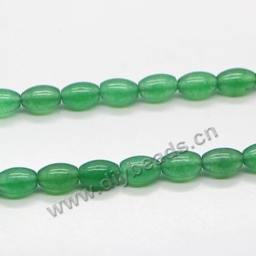 Bead, green aventurine (natural), 9x12mm oval. Sold per 16-inch strand