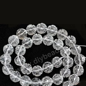 Bead,clear quartz crystal (natural), 10mm carved double side flower. Sold per 16-inch strand