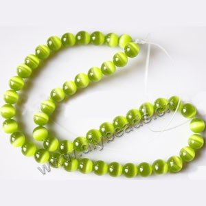Bead, cat's eye glass,grass green, 8mm round, quality grade. Sold per 14.5-inch strand.