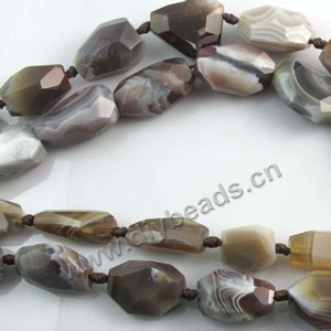 Bead, Botswana agate (natural), 15x23mm faceted nugget. Sold per 16-inch strand.