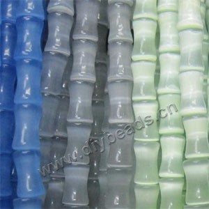 Bead mix, cat's eye glass, multicolored, 17x14mm bamboo. Sold per pkg of (2) 15-inch strands