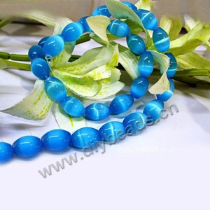 Bead, cat's eye glass, turquoise blue, 14x10mm  oval. Sold per 16-inch strand,approximately 28 beads .