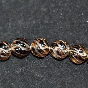Bead, smoky quartz (heated/irradiated), 10mm carved round. Sold per 16-inch strand.