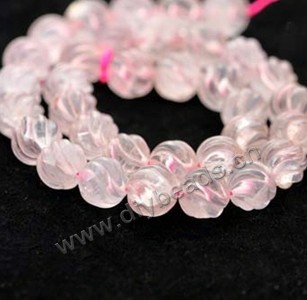 Bead, rose quartz (natural), 12mm carved round. Sold per 15-inch strand