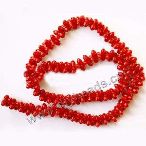 Bead, red coral (imitation), 10x4mm peanut. Sold per 15-inch strand.