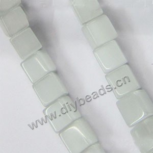 Bead, cat's eye glass, light green,6x6mm cube. Sold per 15-inch strand.