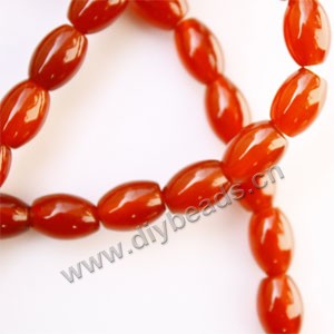 Bead, red agate (dyed), 10x14mm oval. Sold per 15-inch strand.