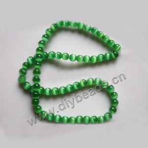Bead, cat's eye glass,green, 6mm round, quality grade. Sold per 14.5-inch strand.