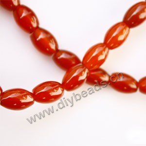 Bead, red agate (dyed), 8x12mm oval. Sold per 15-inch strand.